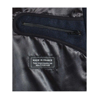 Interior view of men's wool coat showing black lining, zip pocket, and 'Made in France' label.