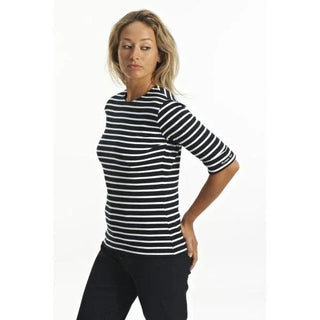 Woman wearing navy and white striped Breton top with 3/4 sleeves on white background