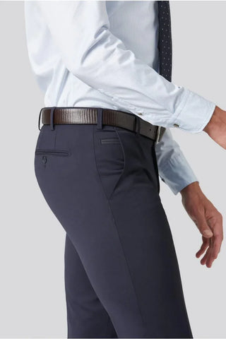 Men's navy wool trousers with dress shirt and leather belt