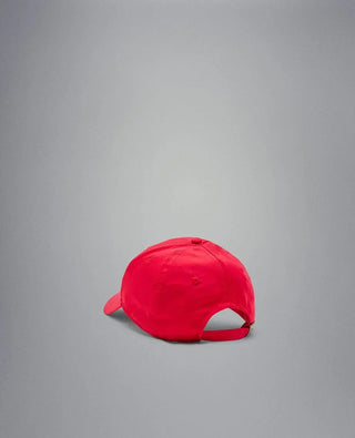 Red nylon baseball cap with adjustable strap, rear view on gray background