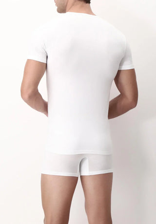 Man wearing fitted white crew neck t-shirt and boxer briefs, back view, plain background